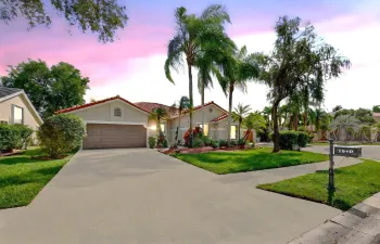 Welcome home to the beautiful tree-lined boutique neighborhood of Sunset Springs! Long driveway on edge of culdesac lakefront lot!