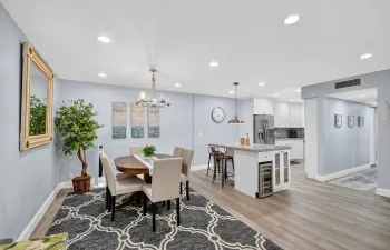 Stunning entrance to the space with a coastal decor throughout. New roof, AC, Impact Windows!