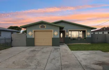 Step into this inviting home with a spacious, wide front yard that provides a sense of openness and curb appeal.