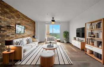 Ample living room with a great view and access to a large balcony with impact windows (virtually staged)