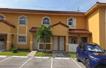 Front of building with parking