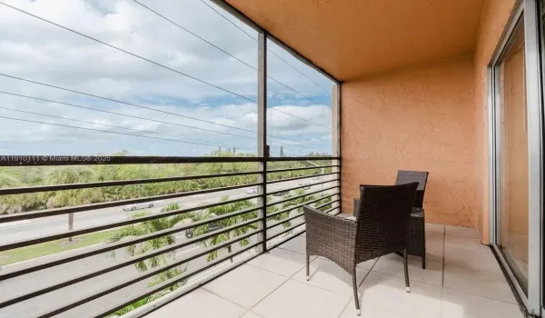 Relax and unwind on your private screened balcony with peaceful lake views, the perfect spot for morning coffee or evening sunsets in Sunrise, Florida.