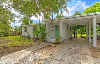 3/2 W/ CARPORT , STUDIO/STORAGE, LARGE BACKYARD IN THE HEART OF HOMESTEAD.