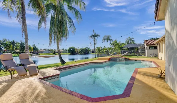 Relaxing backyard with pool, spa and lakeview