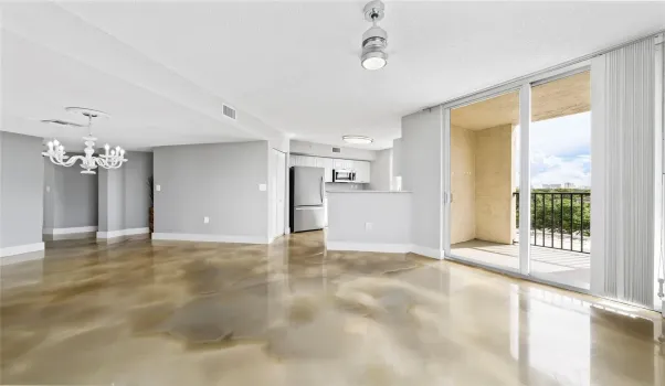 Beautiful living and dining with great natural lighting and views of Las Olas Blvd, coastline and pool.
