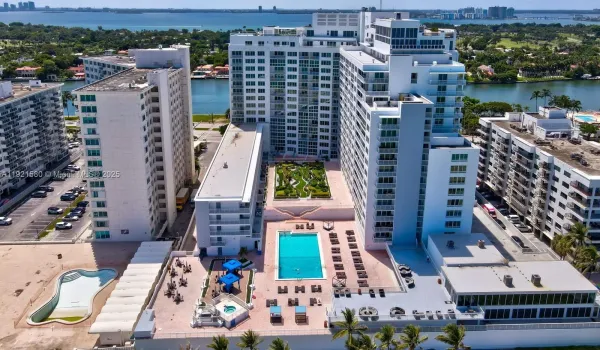 Unit located on top floor of the low-rise building to the left of the pool