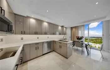 large chef's kitchen with breaksfast area