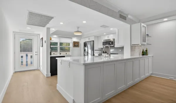 Additional storage cabinets and mini bar on dining room side!