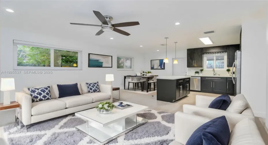 Welcome to your spacious open concept living room, a perfect blend of modern design and functional living.