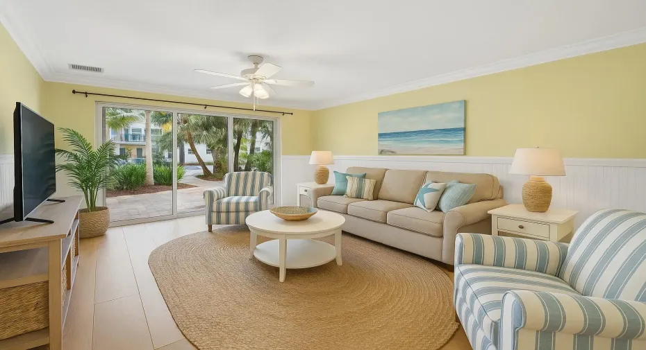 Virtually staged living area with serene flow to the oversized patio, just steps from the heated pool, BBQ, and fitness center.