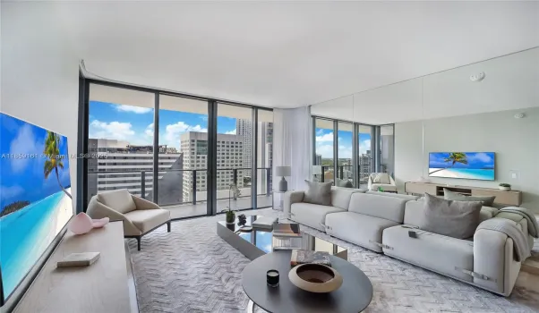 Living Room. Custom mirror wall, reflecting light and expanding views from all angles.