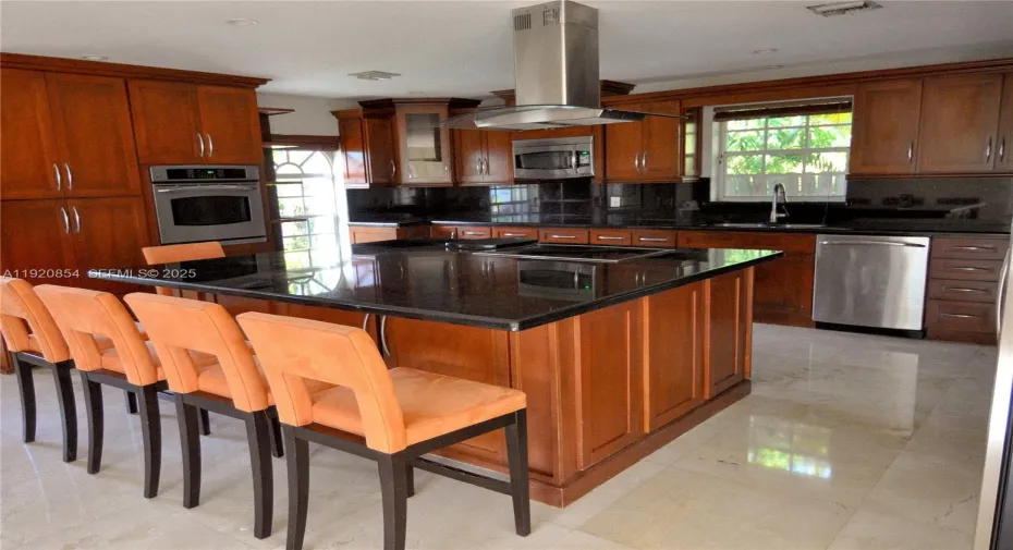 The marble kitchen counter is 7 Ft. wide by 6 Ft. long. The five kitchen-counter stools are part of the lease.