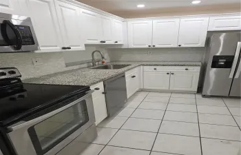REMODELED KITCHEN WITH GREAT STANLESS STEEL APPLIANCES