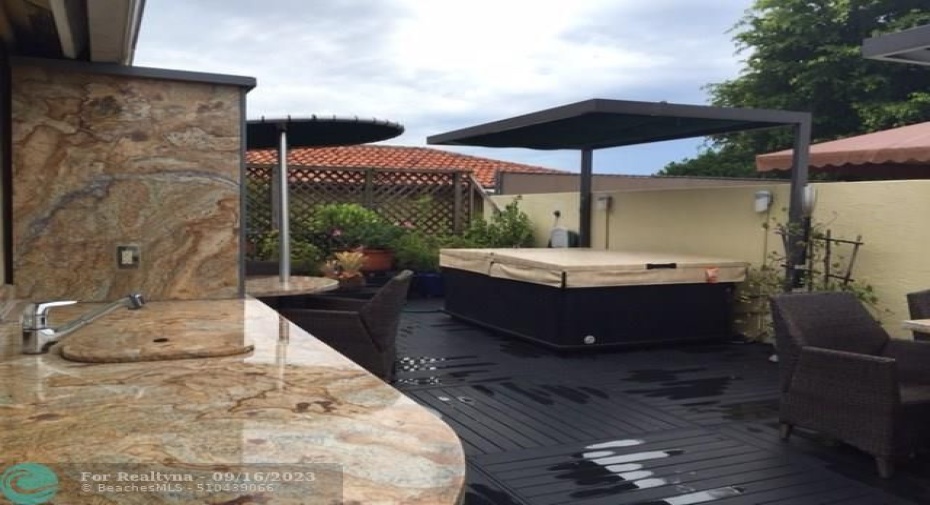 Roof top summer kitchen with TV entertainment center