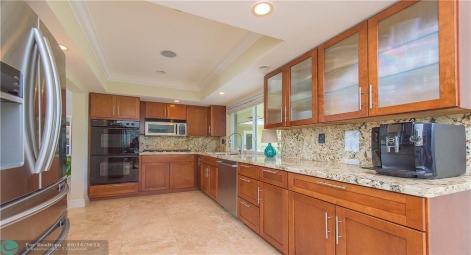 Hardwood Cabinetry and Marble Countertops