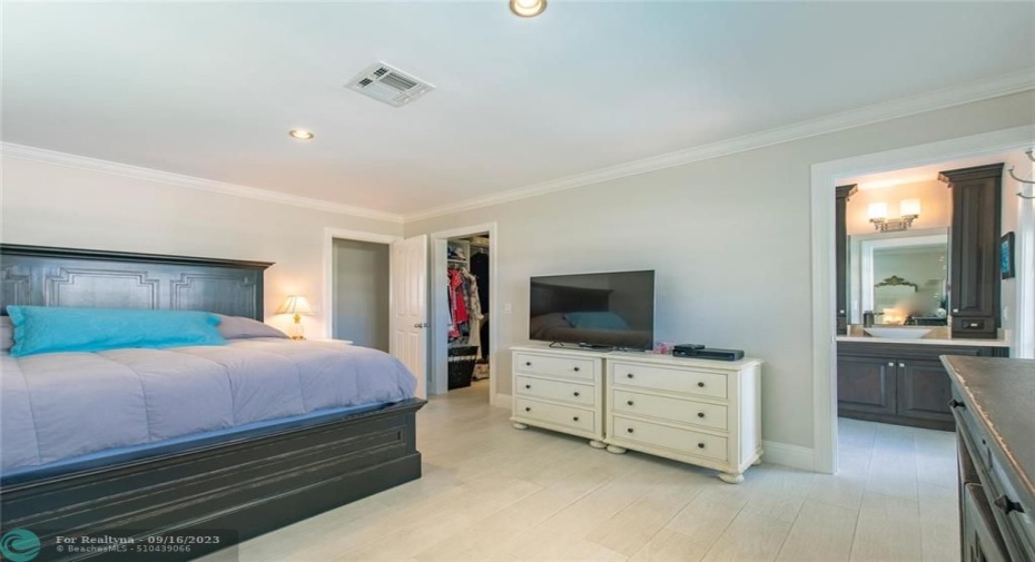 One of two master suites featuring a walk-in closet and private bathroom
