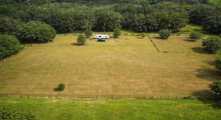 Aerial view of field with RV