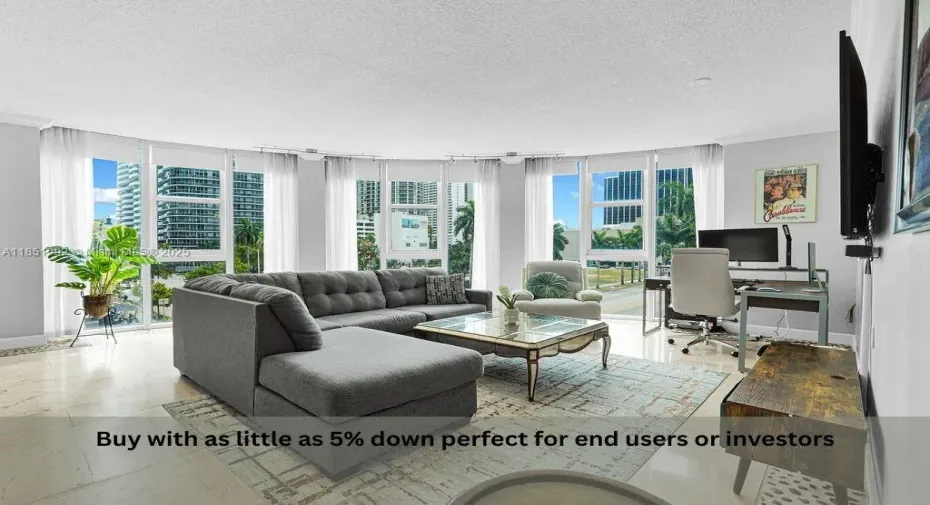 Bright and modern living area featuring floor-to-ceiling windows, abundant natural light, and open-concept design perfect for entertaining. Enjoy elegant finishes, neutral tones, and city views in this Miami high-rise condo near Biscayne Bay.