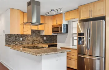 Open-concept kitchen with stainless steel appliances
