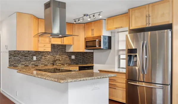 Open-concept kitchen with stainless steel appliances