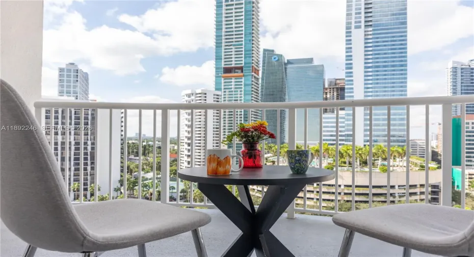 Large Balcony overlooking Brickell Condos on Brickell Avenue ,  FOUR SEASON hotel pool , landscaping and beautiful SUNSETS!!!