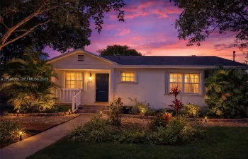 Digitally enhanced twilight view to showcase the home's curb appeal and evening ambiance. Actual home exterior, styled for visual impact.