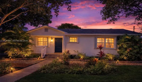 Digitally enhanced twilight view to showcase the home's curb appeal and evening ambiance. Actual home exterior, styled for visual impact.