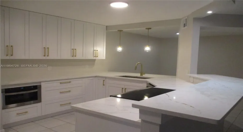 UPDATED OPEN KITCHEN INTO DINING & LIVING AREA