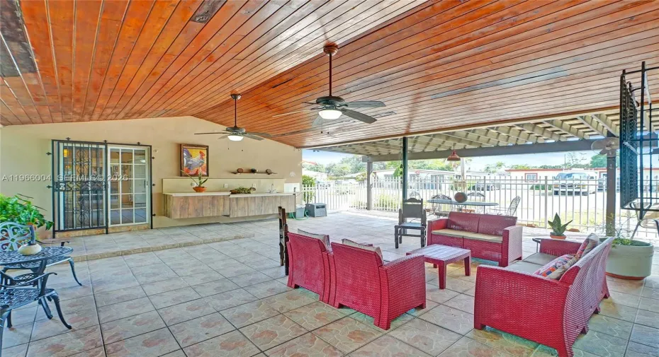 ENORMOUS TERRACE WITH FLOATING CABINETS AND SINK FOR COOKOUTS.