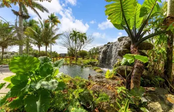 10 FT WATERFALLS BETWEEN THE HOUSE AND TIKI PAVILLION