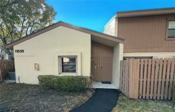 Property Front with fenced in patio