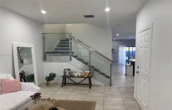 Entry foyer with a beatiful and modern handrail