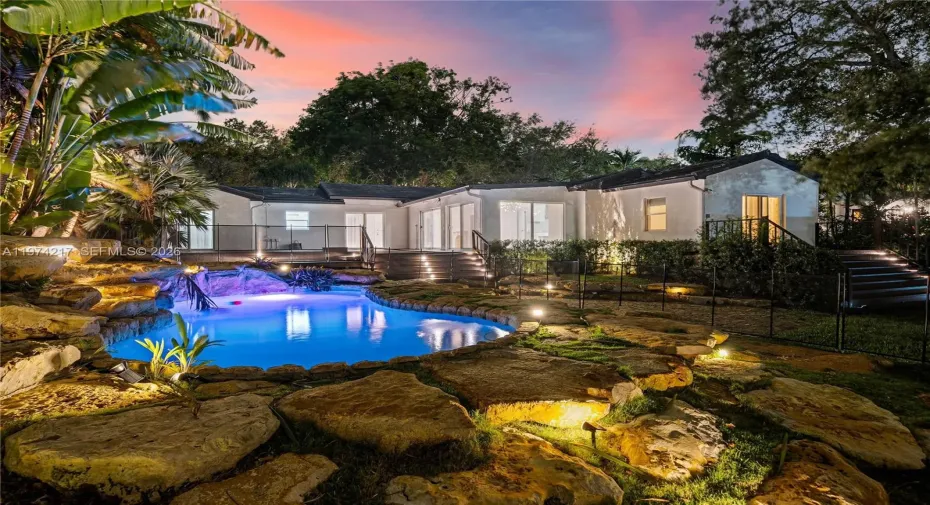 Lagoon style pool with rock accents