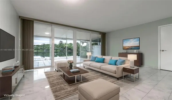 Living room with great view of the outside lake. Virtually enhanced
