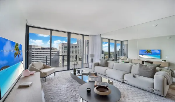 Living Room. Custom mirror wall, reflecting light and expanding views from all angles.