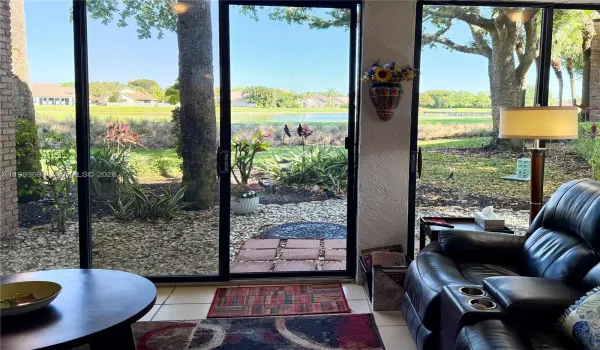 Experience panoramic golf and lake views from this rare corner residence