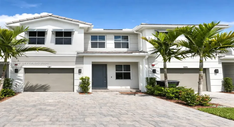 Stunning modern facade with private garage and premium curb appeal