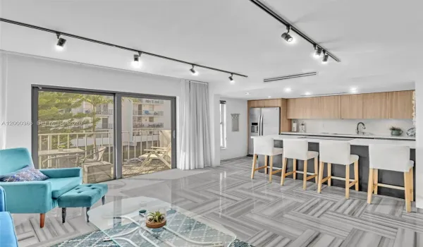 Stylish sunny living room open to kitchen