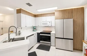 Sharp renovated kitchen complete with cabinetry ambient up lighting