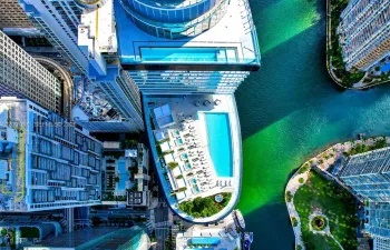 Luxury waterfront living at Aston Martin Residences Miami. Iconic architecture, resort-style pool deck, and panoramic views of Brickell and the Miami River.