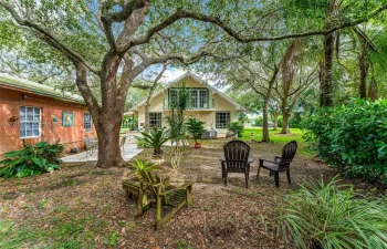 THIS PROPERTY IS A BLAST FROM THE PAST.. NEEDS MINOR TLC. MAIN 3/2 ,1/1 STUDIO ,2 OUTBUILDINGS W BATH/ OFFICE, CARPORT, INCOME  GROVE AT THE END OF THE STREET,LG LUSHOAKS PLUS...