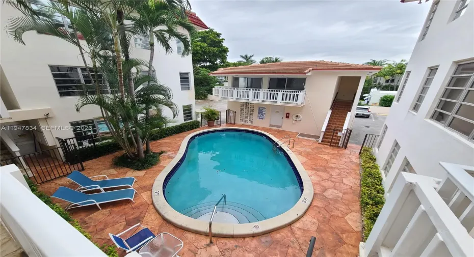 View of the communal pool from the catwalk of the 2nd floor where the unit entrance is.