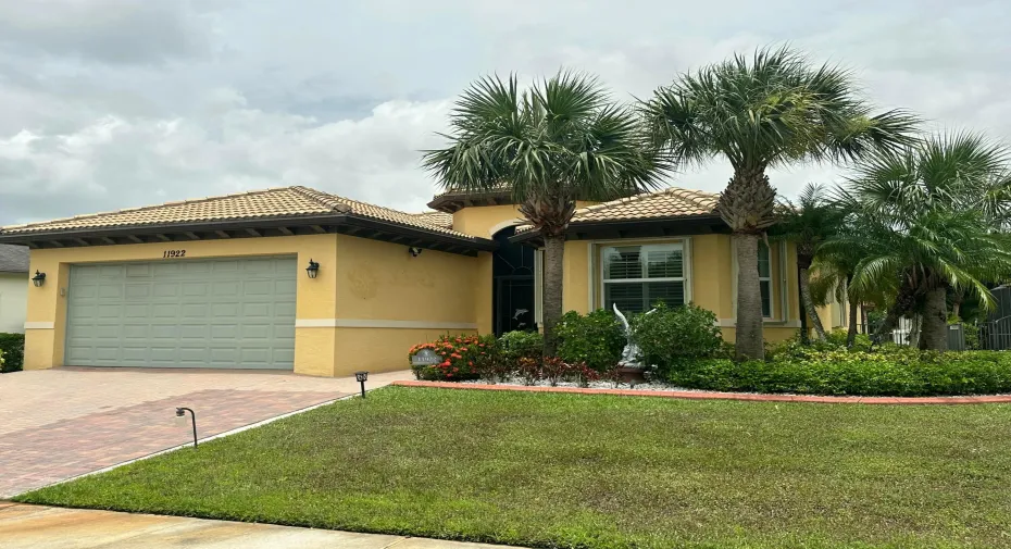 Front Curb Appeal-HOME OFFERS ACCORDION SHUTTERS FOR PEACE OF MIND.