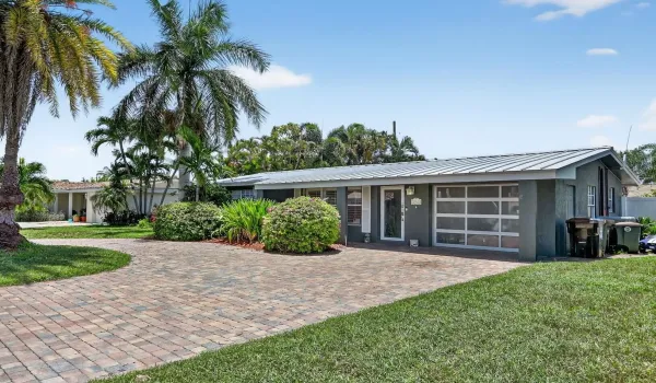 Beautiful curb appeal with oversized circular paver driveway