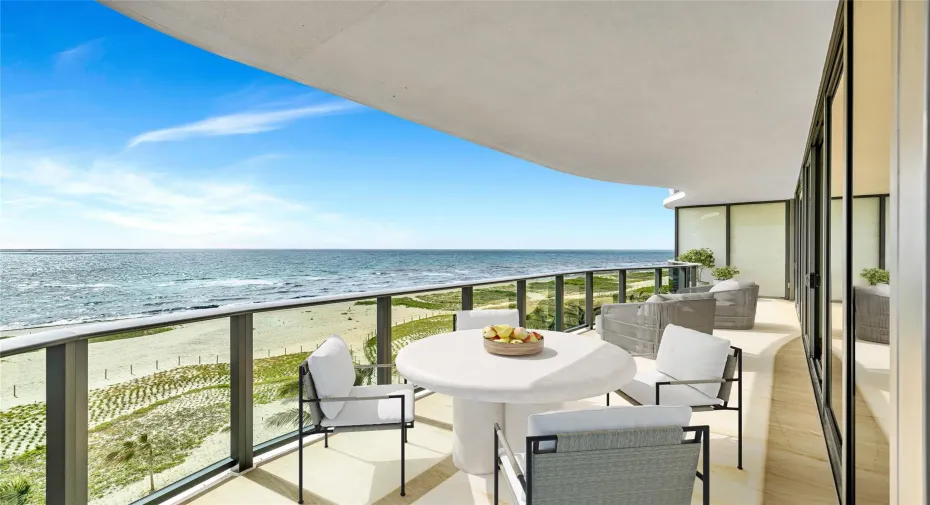 Spacious terrace overlooking the beach and ocean (virtually staged)