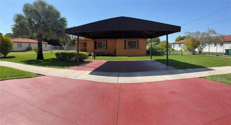 Front of home. Covered Parking