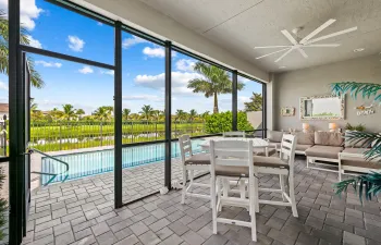 Covered screened lanai and open pool patio