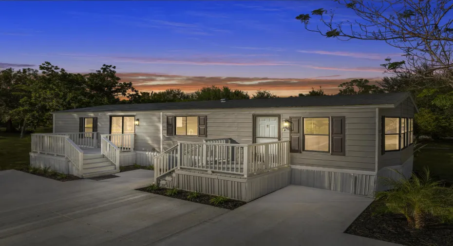 Manufactured / mobile home with a wooden deck
