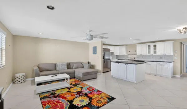 totally remodeled kitchen with custom lighting, newer cabinets & counters, and appliances