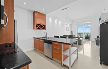 Kitchen open to Dining and Living Spaces